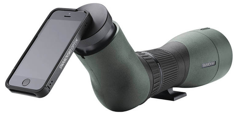 Image of an iPhone, mounted via smartphone adapter on a spotting scope by Swarovski.