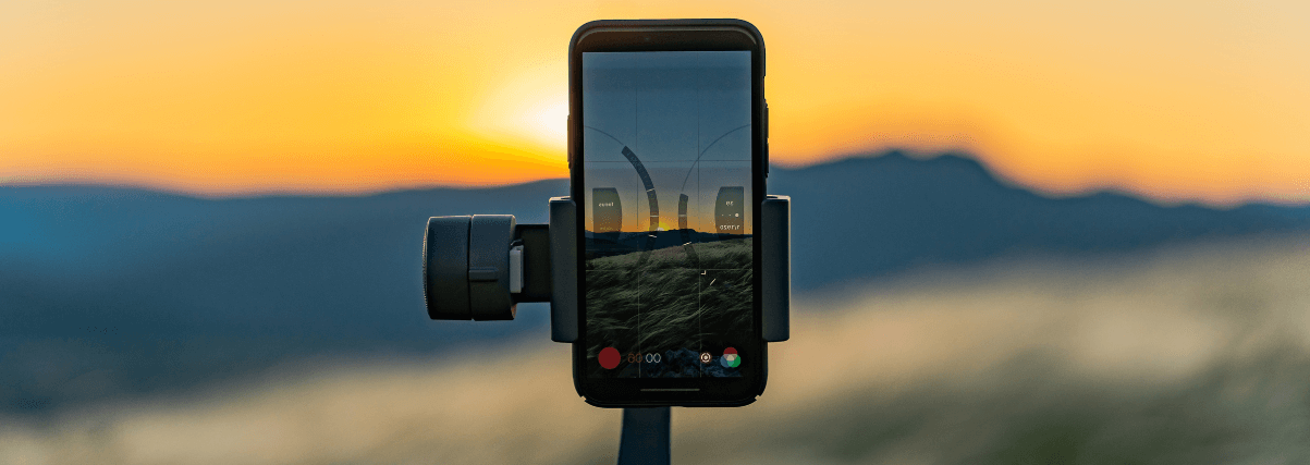 A cell phone holder on a tripod - as an example of spotting scope accessories.
